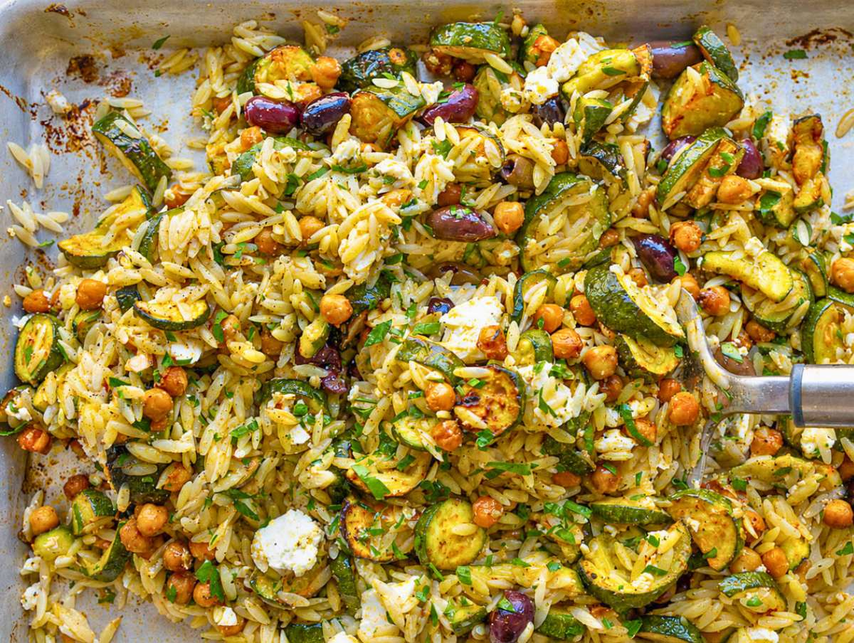 Step 3 Roasted zucchini orzo gently tossed together on the sheet pan until combined.